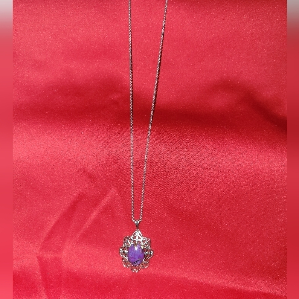 Silver necklace with purple stone. No marking